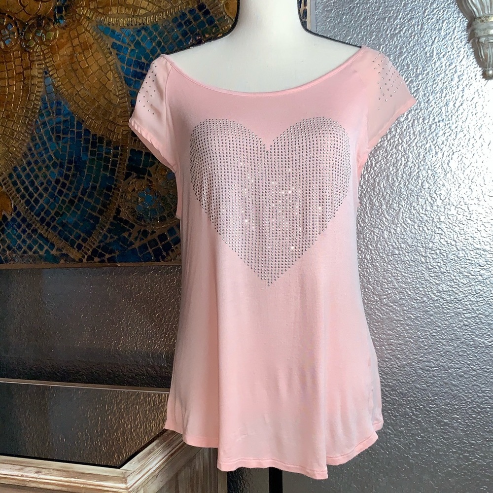Pink top with bling heart design.